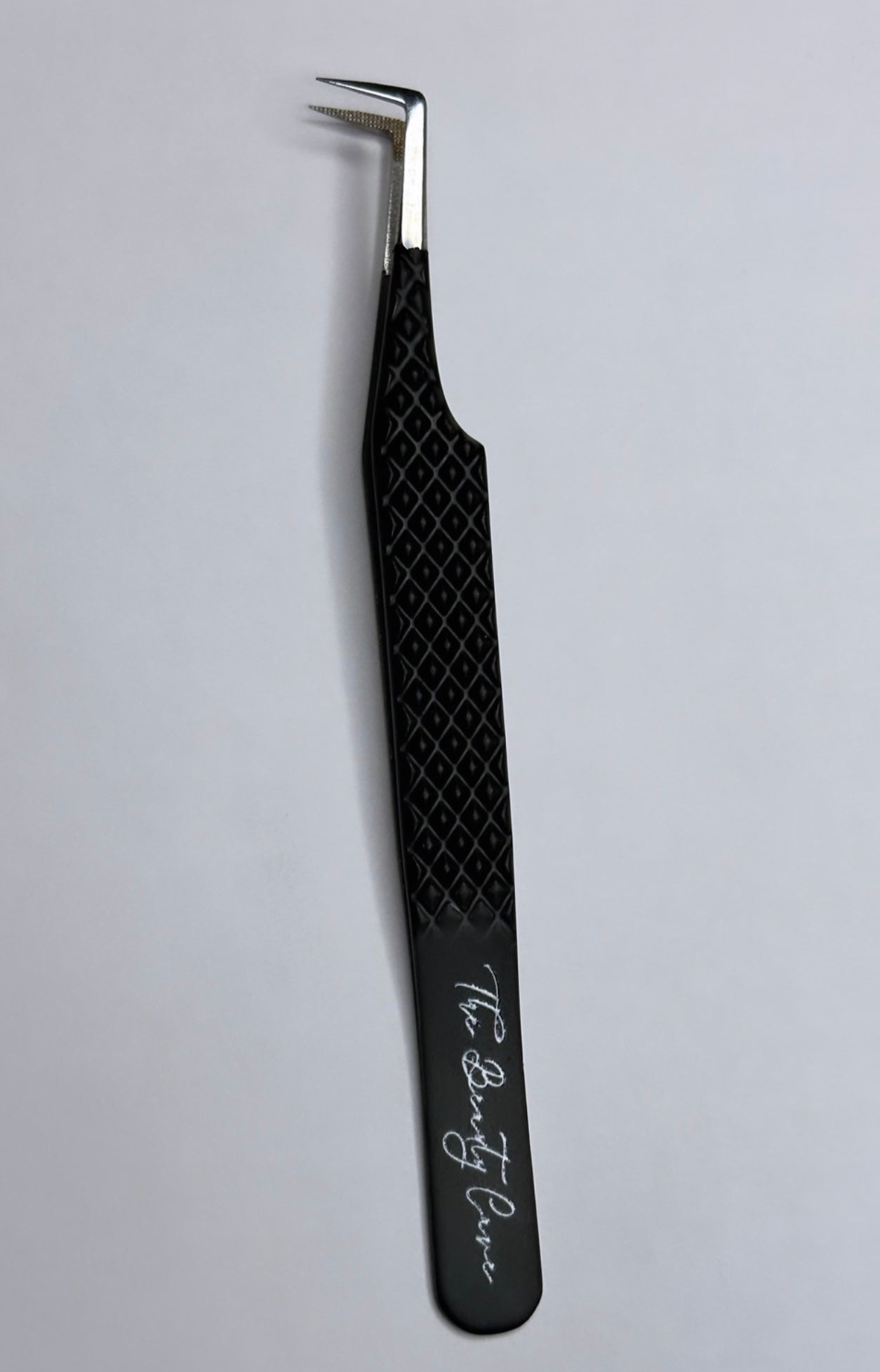 Pitch black tweezer